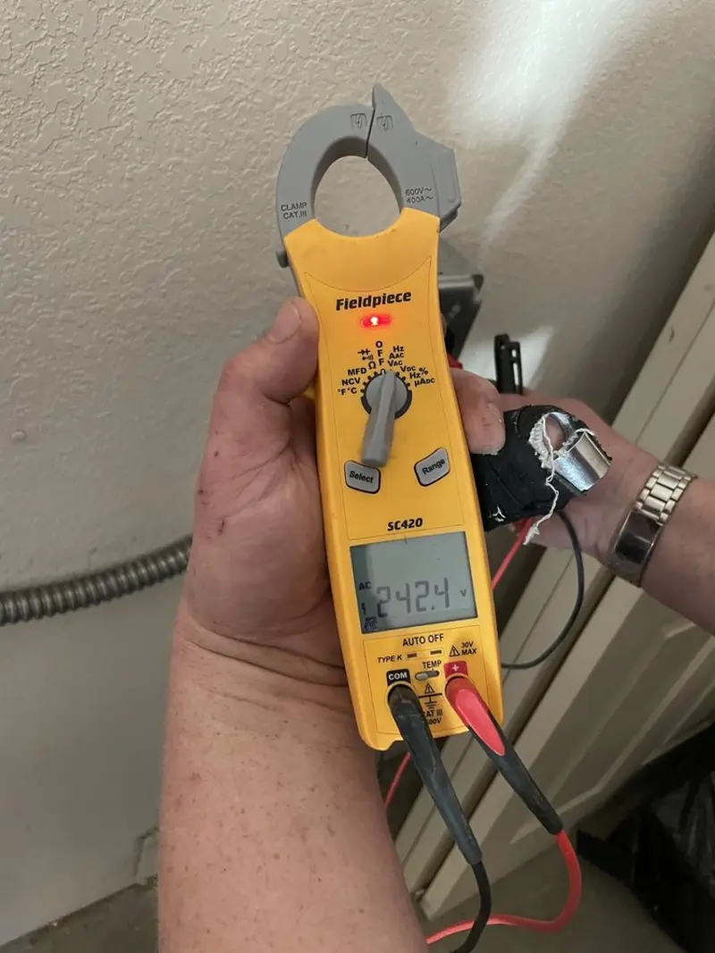 Voltage testing with clamp meter during Electrical Installation Services in Horseheads